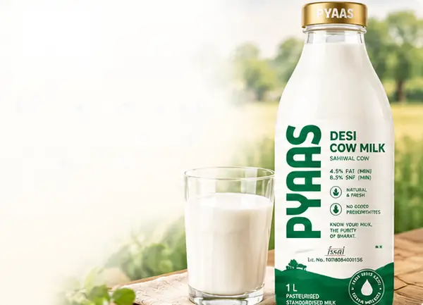 A PYAAS milk bottle and a glass of milk on a farm table